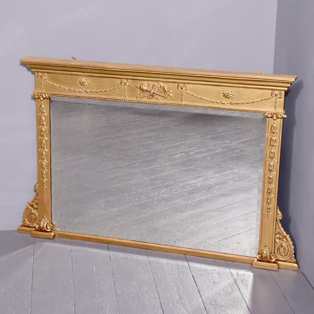 Neat size Regency Gilded Overmantel Mirror with Neoclassical Decoration