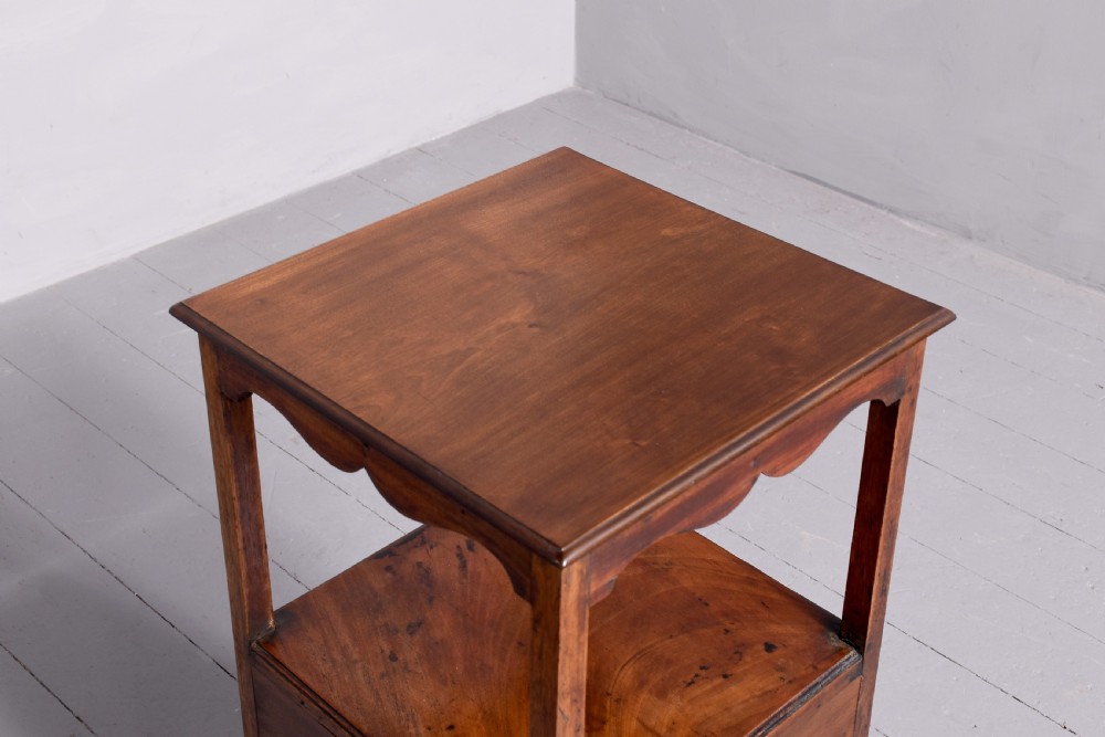 A square two-tier mahogany occasional table featuring slender uprights, a scalloped frieze detail, and a cross-stretcher base. View IV