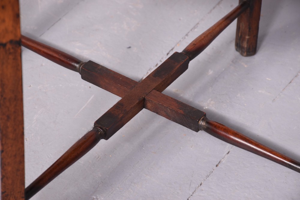 A square two-tier mahogany occasional table featuring slender uprights, a scalloped frieze detail, and a cross-stretcher base. View VIII