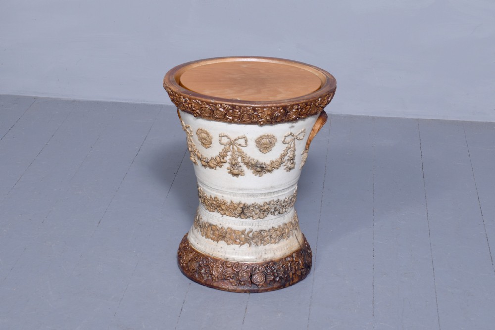 A Victorian glazed stoneware water filter urn decorated with relief crest motifs, floral borders, side handles, and a fitted wooden lid. View III