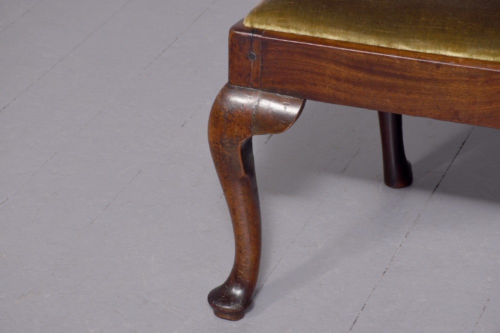 A George II carved mahogany side chair featuring a pierced strapwork splat back, green velvet seat, and cabriole front legs with pad feet. View IV