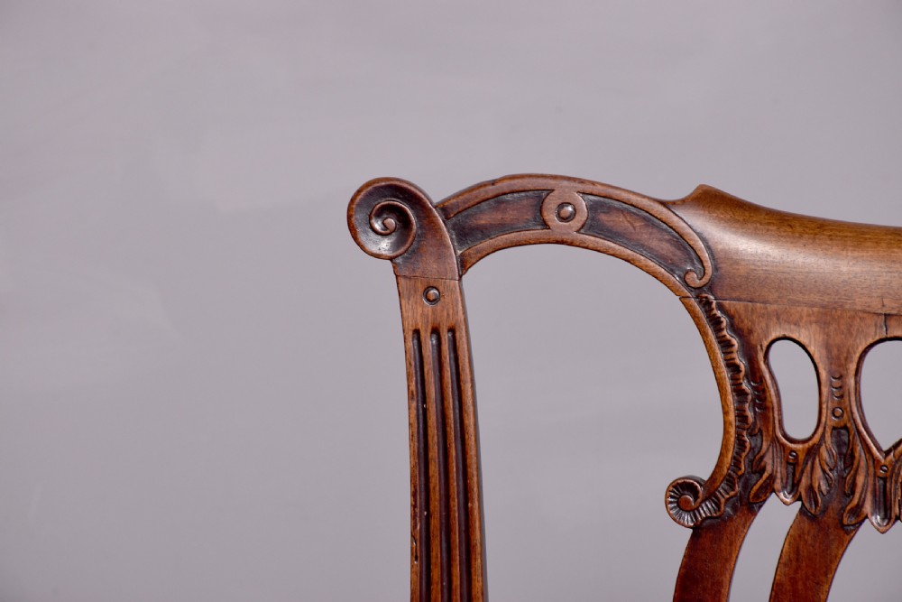 A George II carved mahogany side chair featuring a pierced strapwork splat back, green velvet seat, and cabriole front legs with pad feet. View VI