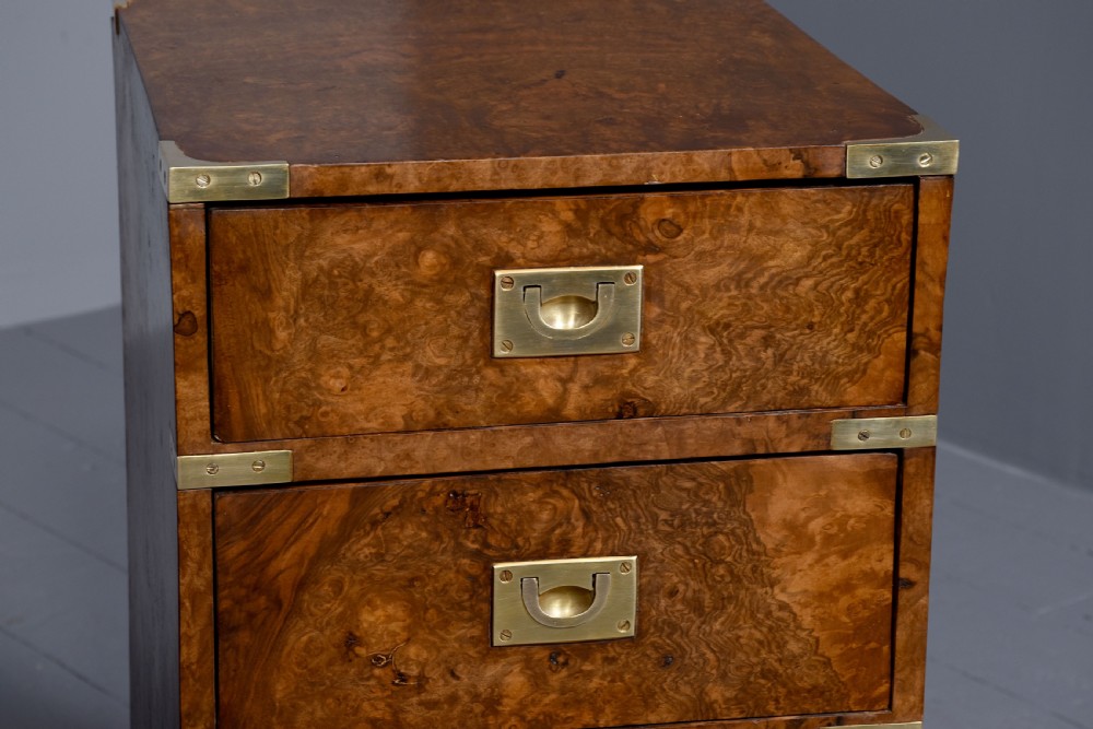 A pair of Victorian burr walnut military style small chests of drawers featuring flush brass handles, corner brackets, and four graduated drawers. View IV