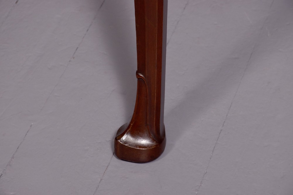 A large crossbanded mahogany library desk featuring three frieze drawers and slender cabriole legs. View II