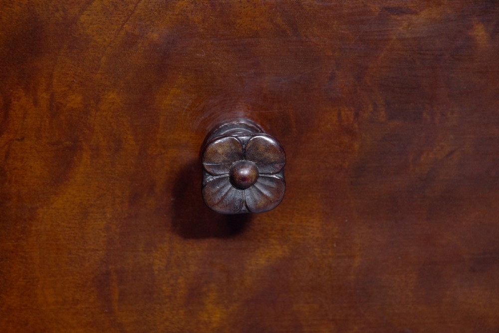 A large crossbanded mahogany library desk featuring three frieze drawers and slender cabriole legs. View IV