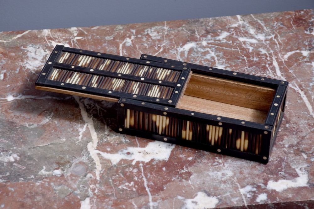 An Edwardian rectangular porcupine quill box with dark ebonised wooden framing and circular bone dot inlays. View IV