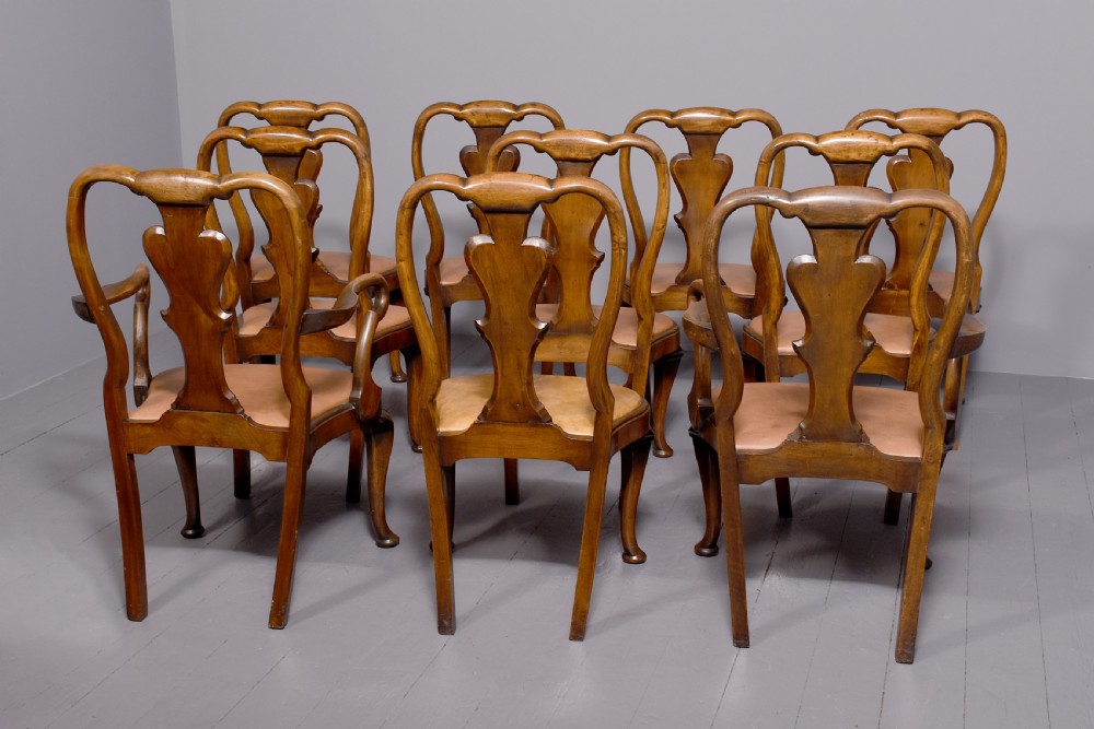 A set of ten George II walnut dining chairs with vasiform back splats, leather upholstery, and cabriole legs. View VIII