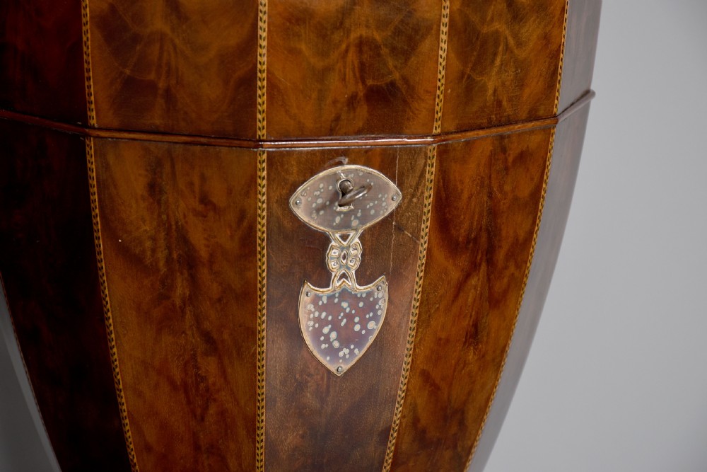 A pair of neoclassical mahogany urn-shaped cutlery boxes with fine line inlay, turned finials, and silver-toned keyhole escutcheons. View III