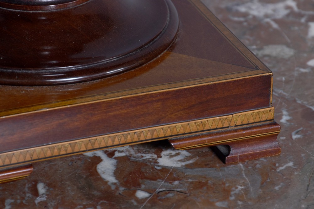 A pair of neoclassical mahogany urn-shaped cutlery boxes with fine line inlay, turned finials, and silver-toned keyhole escutcheons. View V