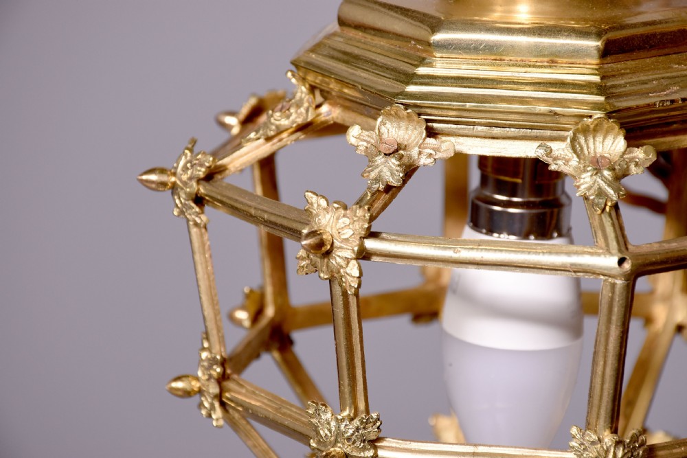 A French hexagonal ormolu ceiling lantern featuring ornate leaf scrollwork, a top crown canopy, and a suspended chain fitting. View III