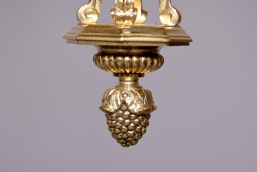A French hexagonal ormolu ceiling lantern featuring ornate leaf scrollwork, a top crown canopy, and a suspended chain fitting. View IV