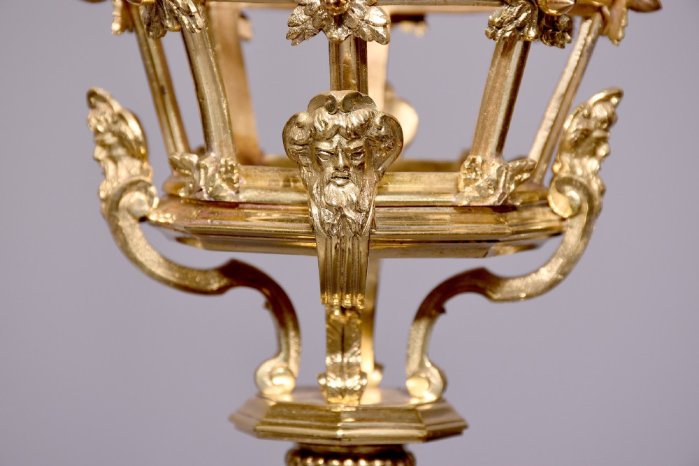 A French hexagonal ormolu ceiling lantern featuring ornate leaf scrollwork, a top crown canopy, and a suspended chain fitting. View V