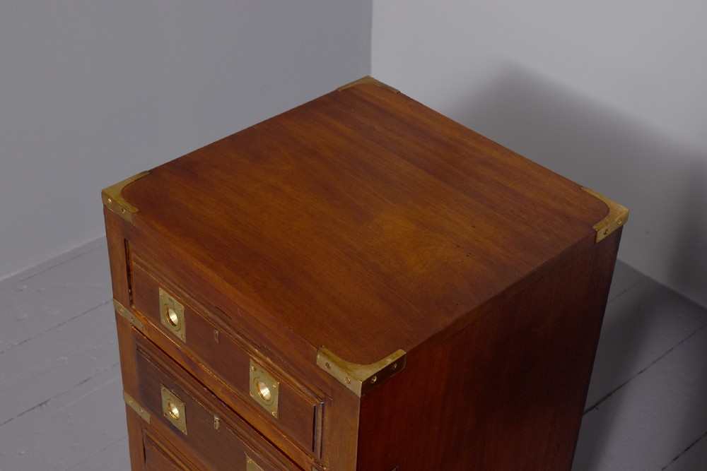 A pair of Victorian mahogany military-style chests with four drawers each, fitted with brass corner mounts and flush handles. View II