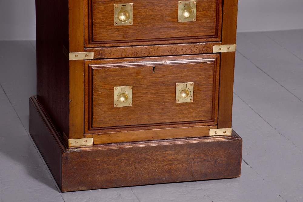 A pair of Victorian mahogany military-style chests with four drawers each, fitted with brass corner mounts and flush handles. View III