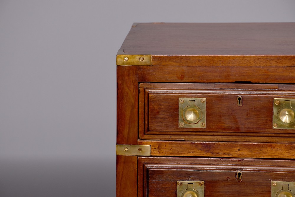 A pair of Victorian mahogany military-style chests with four drawers each, fitted with brass corner mounts and flush handles. View IV