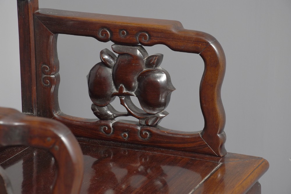 A pair of dark polished hardwood Chinese Qing Dynasty throne chairs featuring intricate openwork carved back splats with longevity symbols and carved armrests. View II
