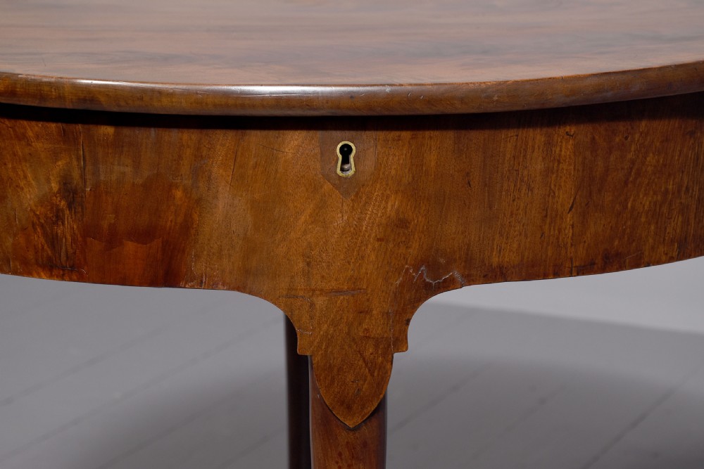 An 18th-century George III mahogany D-shaped card table with cabriole legs and pad feet shown in a folded configuration. View III