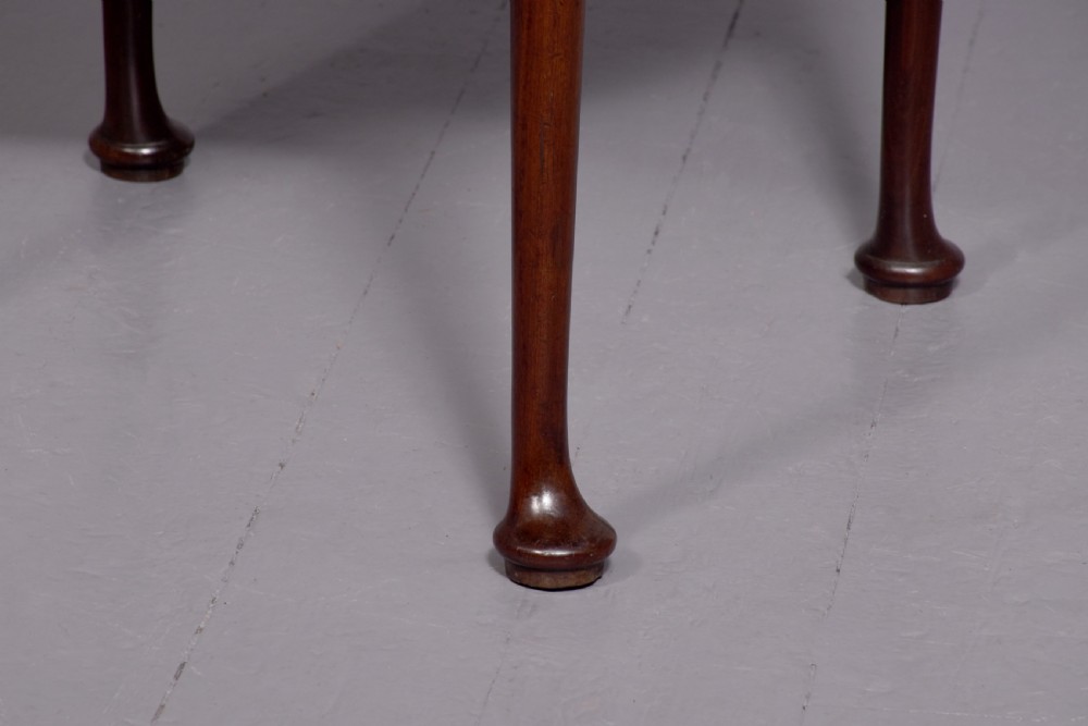 An 18th-century George III mahogany D-shaped card table with cabriole legs and pad feet shown in a folded configuration. View IV
