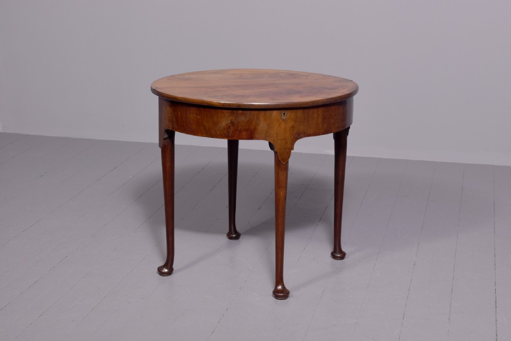 An 18th-century George III mahogany D-shaped card table with cabriole legs and pad feet shown in a folded configuration. View VI