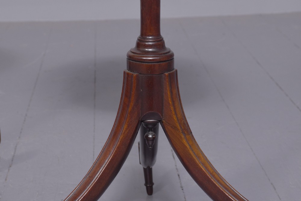 A pair of Regency dark mahogany wine tables featuring circular dish tops, fluted tapered stems, and swept tripod legs. View IV