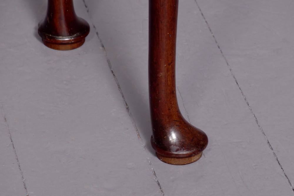 A George III mahogany triple top games table featuring cabriole legs ending in pad feet and a single frieze drawer with a brass handle. View II