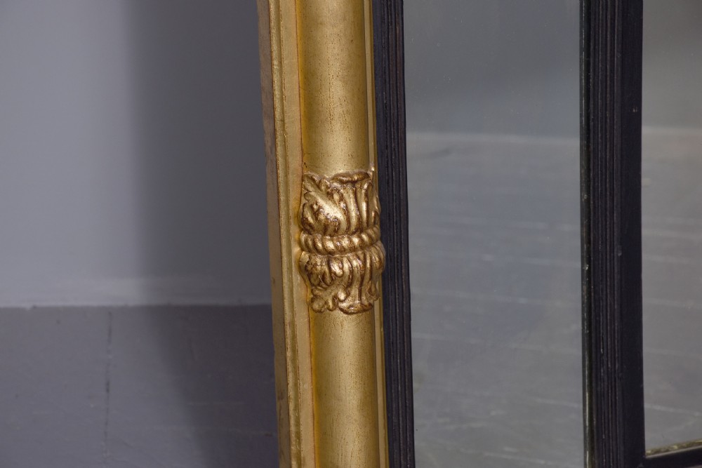 A horizontal Regency giltwood triptych overmantel mirror featuring acanthus leaf columns, a breakfront cornice, and three mirror plates framed with ebonised inner slip. View III