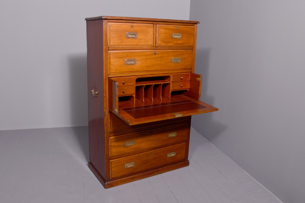A tall Victorian mahogany military secretaire chest featuring multiple graduated drawers with recessed brass handles. View II