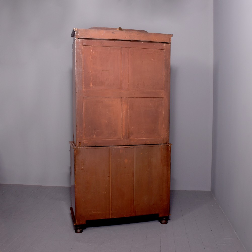 A George IV mahogany secretaire bookcase featuring arched astragal glazed doors, a fitted pull-out writing drawer with brass handles, and twin cupboard doors below. View XI