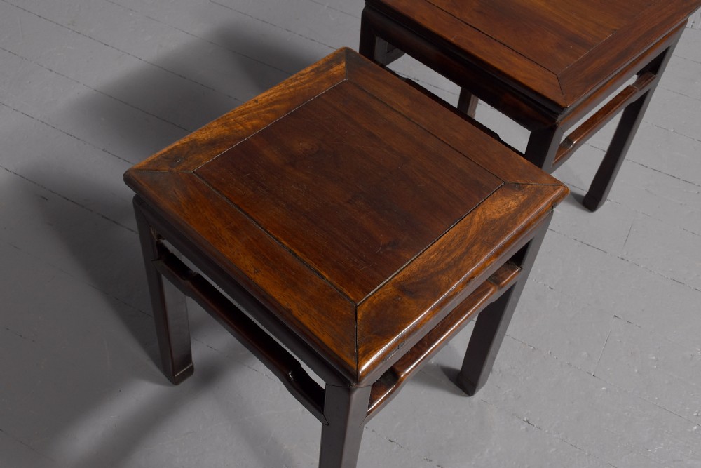 A pair of dark reddish-brown Chinese hongmu hardwood stands featuring square tops, straight legs, and humpback stretchers. View IV