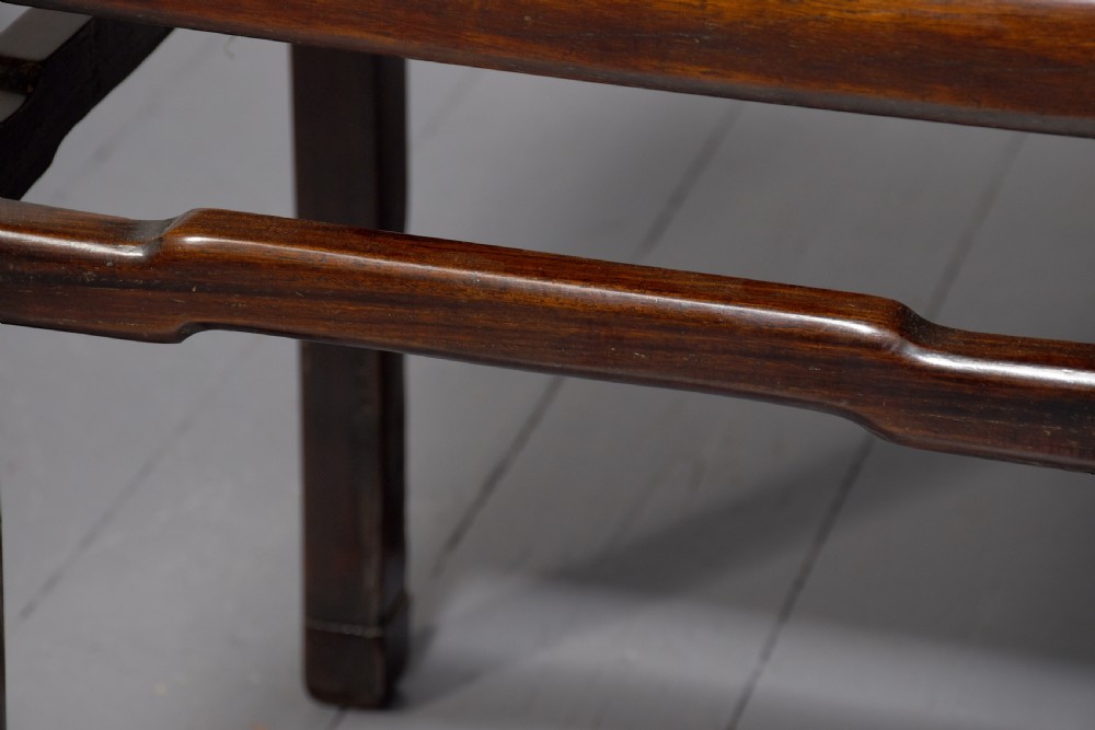 A pair of dark reddish-brown Chinese hongmu hardwood stands featuring square tops, straight legs, and humpback stretchers. View V