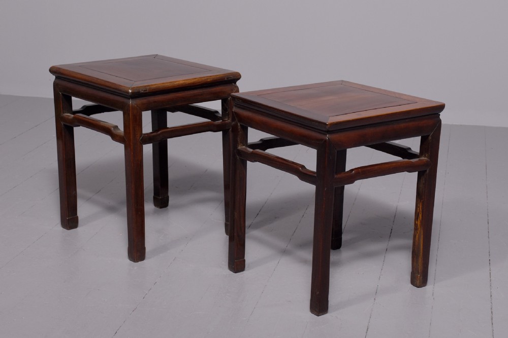 A pair of dark reddish-brown Chinese hongmu hardwood stands featuring square tops, straight legs, and humpback stretchers. View VI