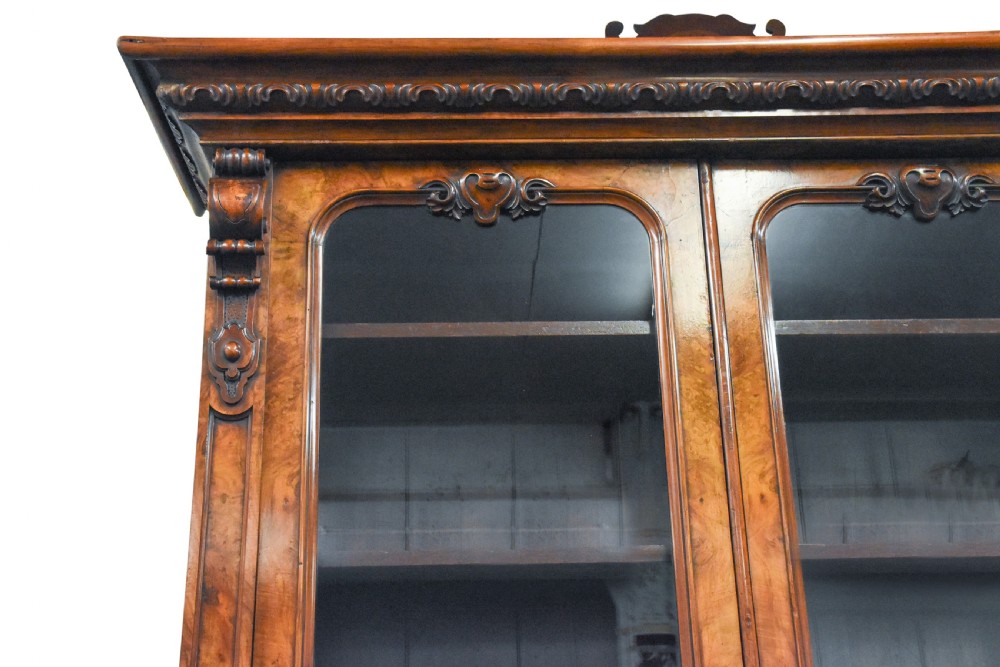 Exhibition quality four door Victorian carved, burr walnut cabinet bookcase View II