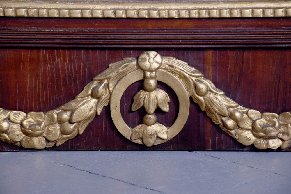 A tall Swedish Gustavian mahogany pier mirror featuring an urn finial cresting and gold gilt decorative swags. View VI