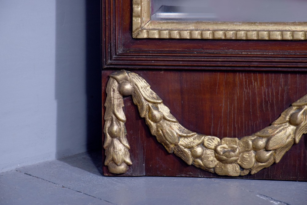 A tall Swedish Gustavian mahogany pier mirror featuring an urn finial cresting and gold gilt decorative swags. View VIII