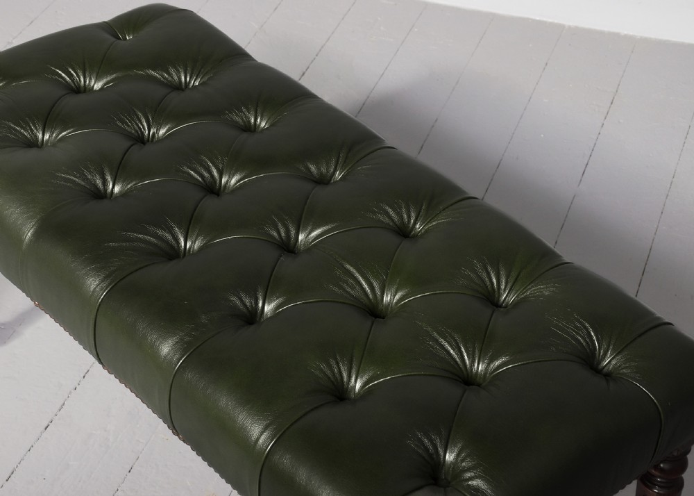 A pair of Regency mahogany benches featuring dark green buttoned leather upholstery trimmed with brass studs, supported by fluted turned legs. View VII