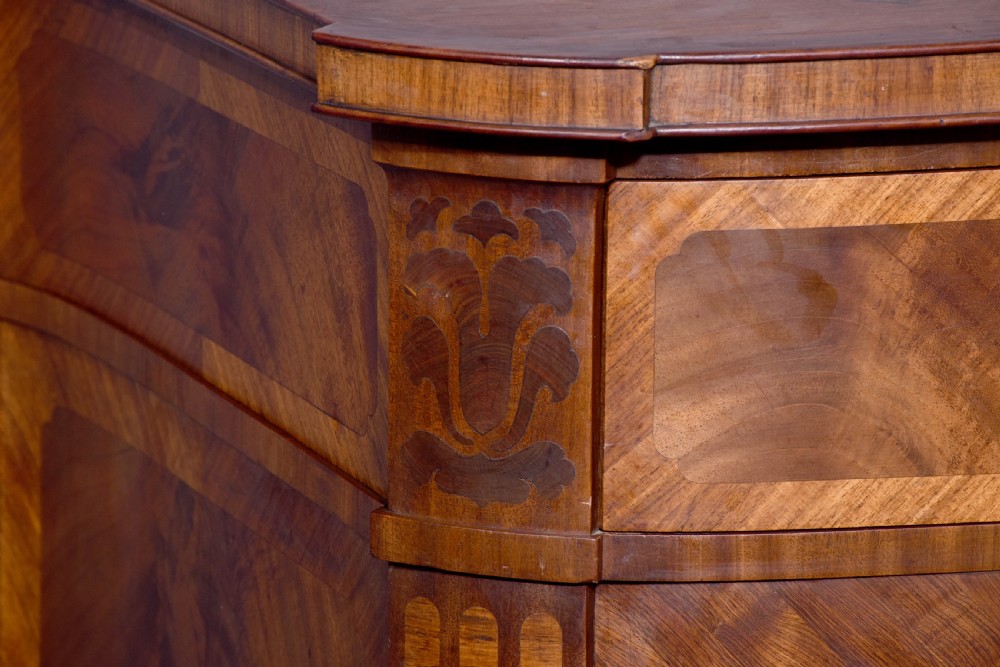A two-door wooden folio cabinet with dark marquetry scroll inlay, upper drawers with ornate brass handles, and short shaped legs. View II