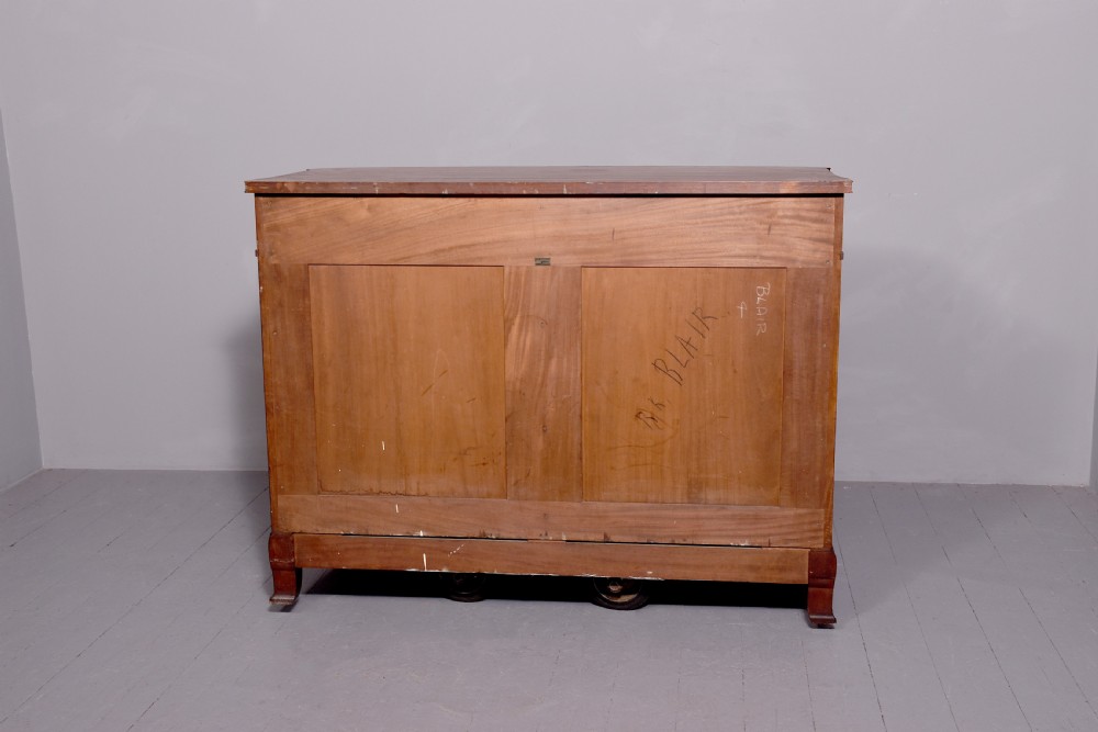 A two-door wooden folio cabinet with dark marquetry scroll inlay, upper drawers with ornate brass handles, and short shaped legs. View XIII