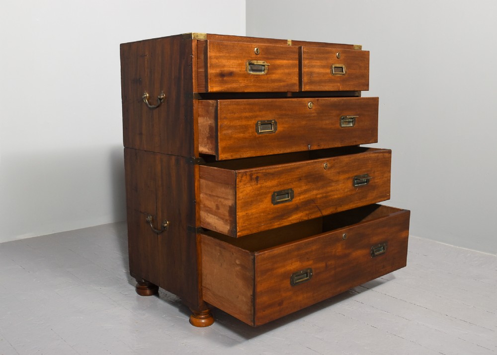 A Victorian two-part mahogany campaign chest with flush brass corner brackets, recessed handles, and turned feet. View IV