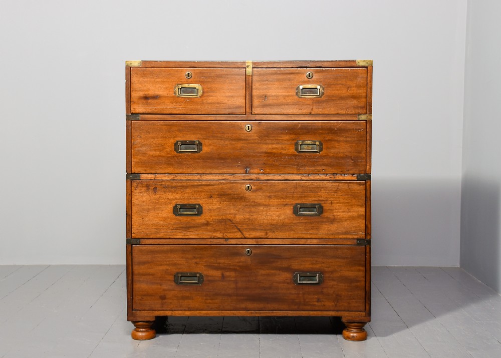 A Victorian two-part mahogany campaign chest with flush brass corner brackets, recessed handles, and turned feet. View VII