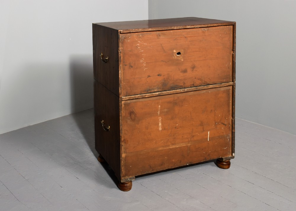 A Victorian two-part mahogany campaign chest with flush brass corner brackets, recessed handles, and turned feet. View VIII