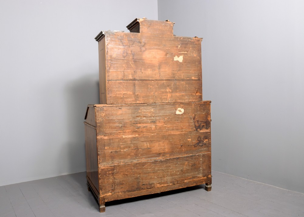 An 18th-century walnut bureau bookcase featuring geometric marquetry, a slant-front writing surface, multiple drawers, and an architectural top pediment. View XVI