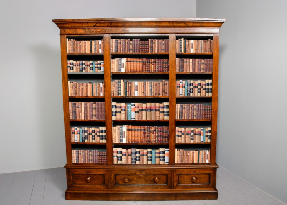 Mid Victorian figured-walnut tall, three-section open bookcase 