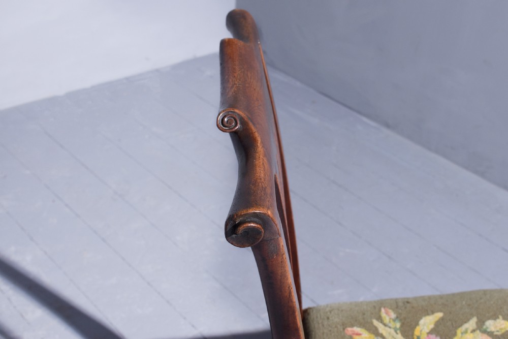 A George II walnut side chair featuring a pierced back splat, floral needlepoint seat, and carved cabriole legs. View III