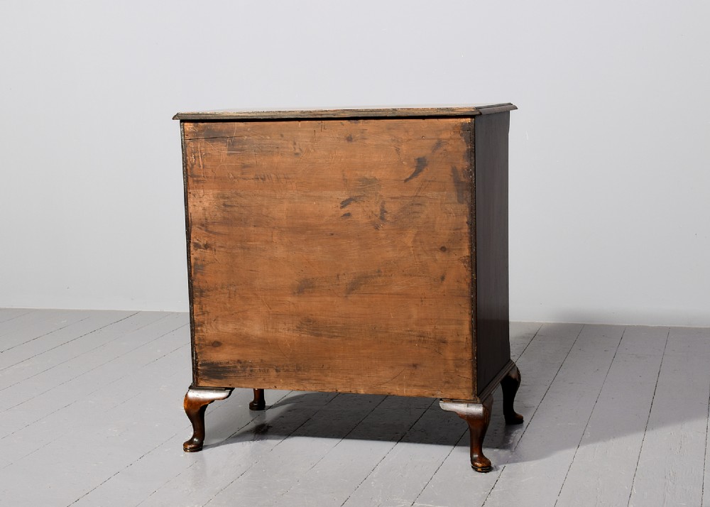 A George II style walnut chest of drawers featuring a contoured front, four drawers with brass handles, and cabriole legs. View IX