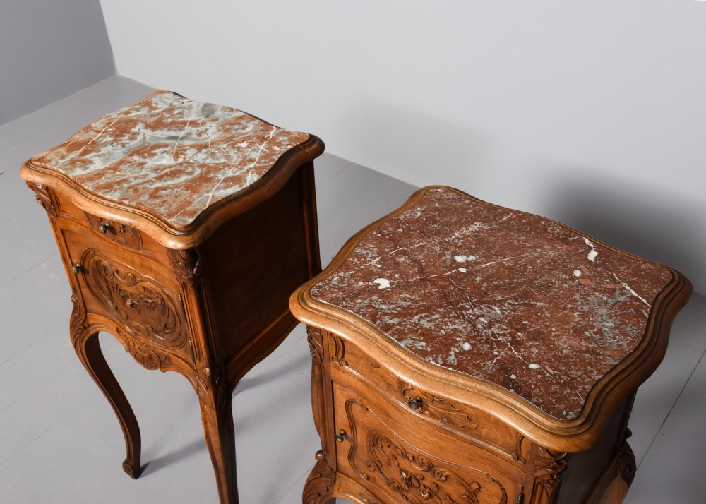A pair of carved walnut French Louis XIV style bedside cabinets featuring marble tops and slender cabriole legs. View II