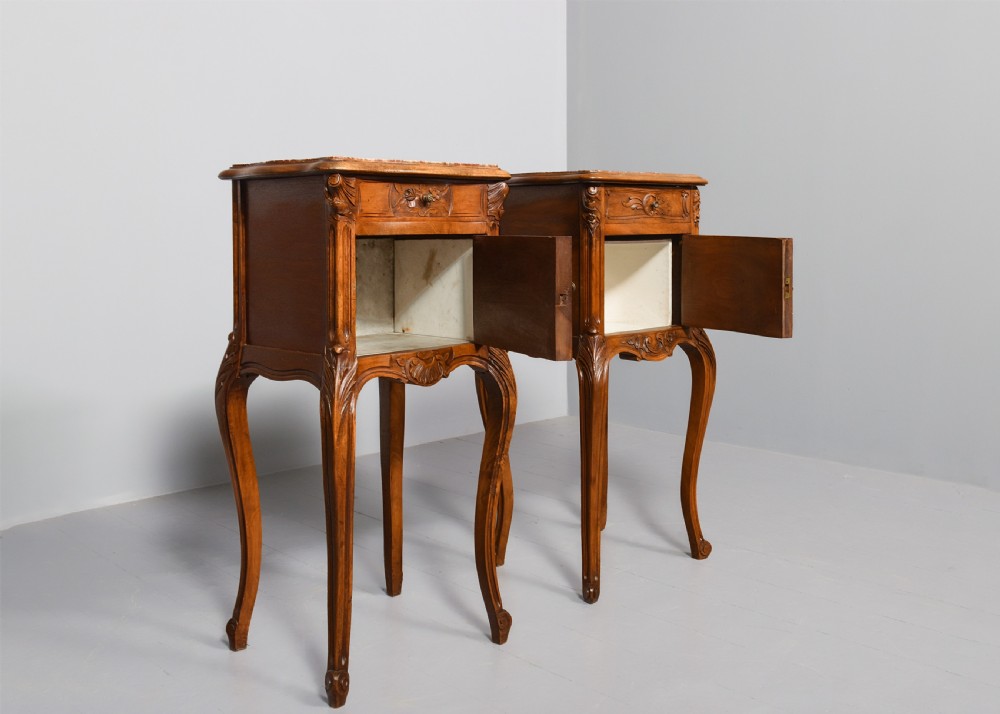 A pair of carved walnut French Louis XIV style bedside cabinets featuring marble tops and slender cabriole legs. View III