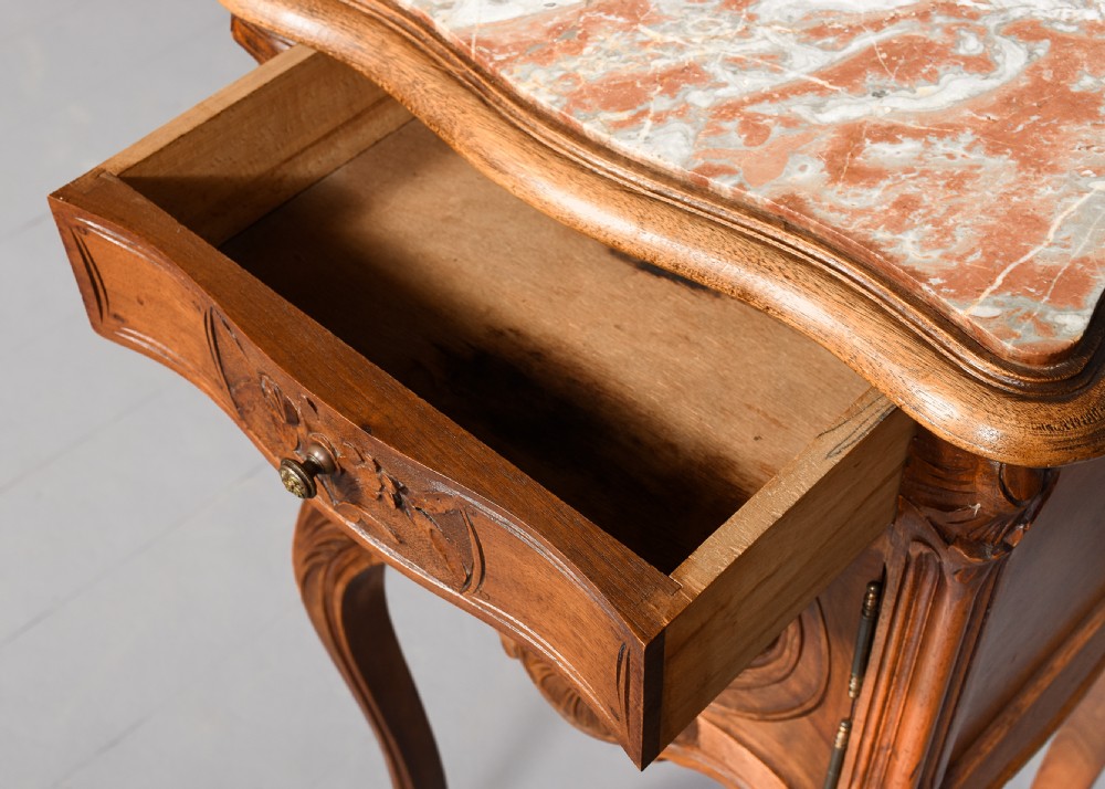 A pair of carved walnut French Louis XIV style bedside cabinets featuring marble tops and slender cabriole legs. View VI