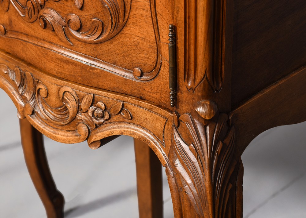 A pair of carved walnut French Louis XIV style bedside cabinets featuring marble tops and slender cabriole legs. View VIII