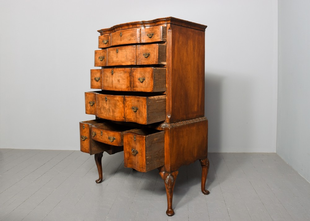 George I style crossbanded, figured walnut chest on stand. View II