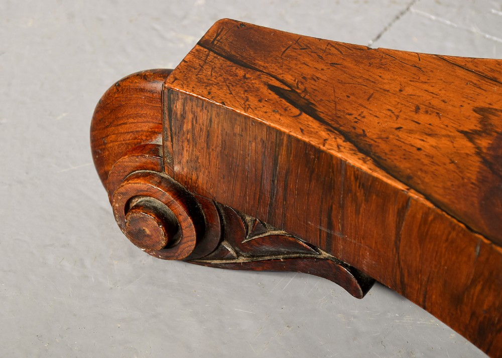 A George IV double-sided rosewood duet music stand featuring carved lyre frames mounted on a brass telescopic stem and a carved triform base. View X